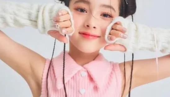 Girl smiling in knitted arm warmers